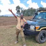 Moses Niyonsenga on a safari in Volcanoes National Park